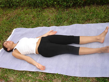 Top view of young woman lying in corpse or dead body pose relaxing after  practicing yoga Stock Photo by ©undrey 161156942